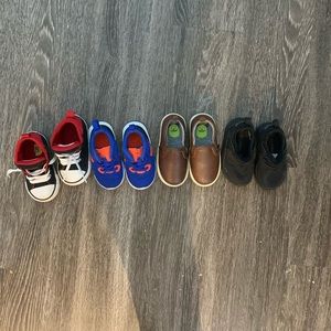 Lot of four pairs of toddler shoes.